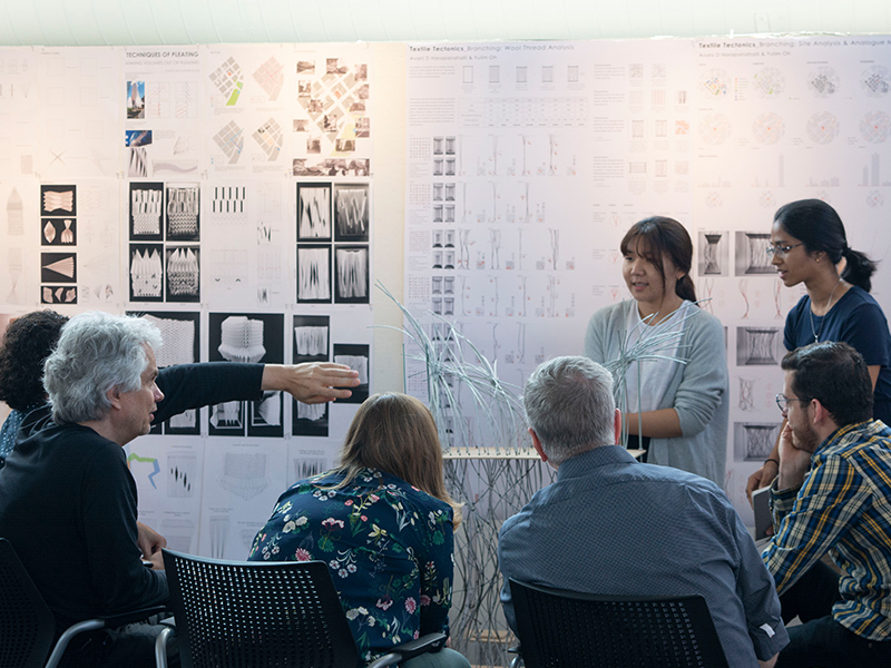 Bachelor of Science Students present their studio project in front of jurors in the Architecture West atrium. 